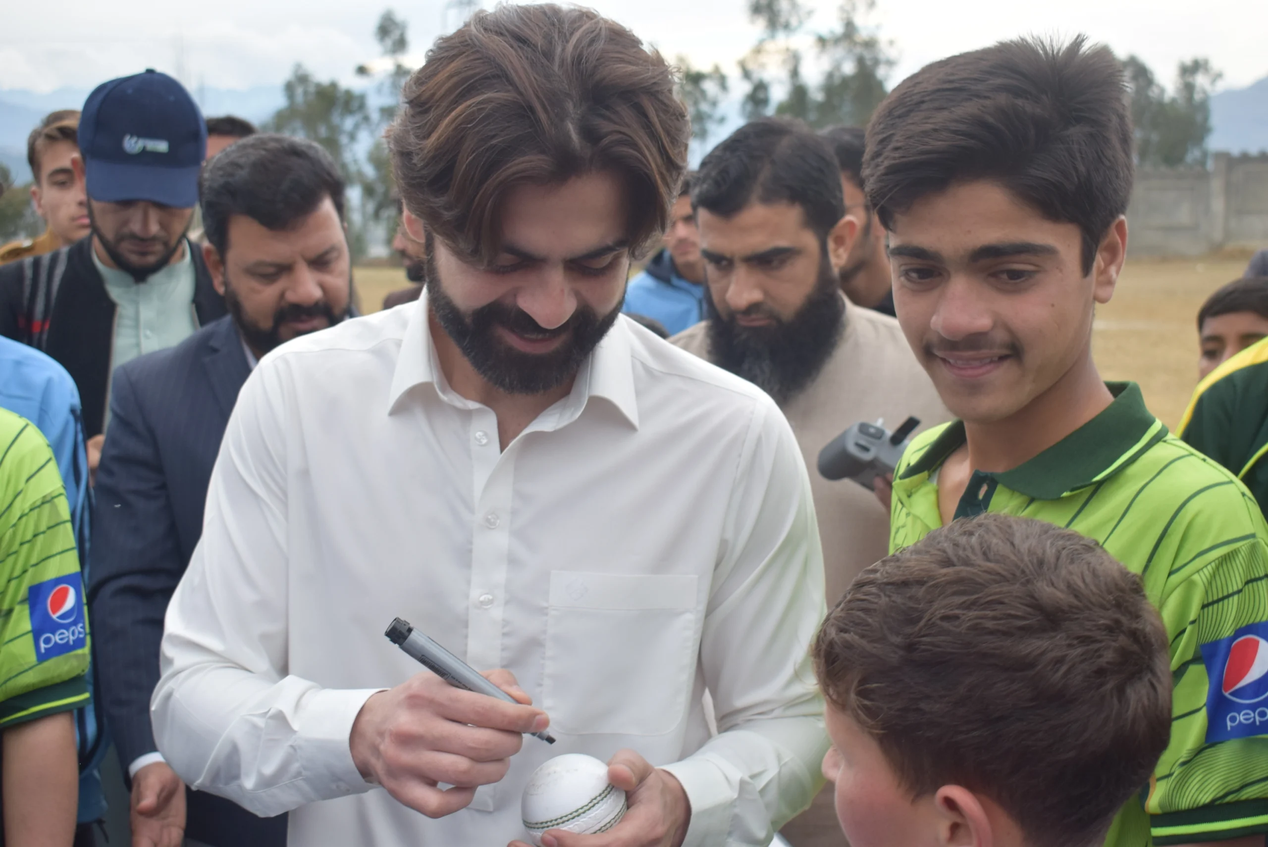 Children enjoying cricket session with Pakistani cricketer Ahmad Shehzad