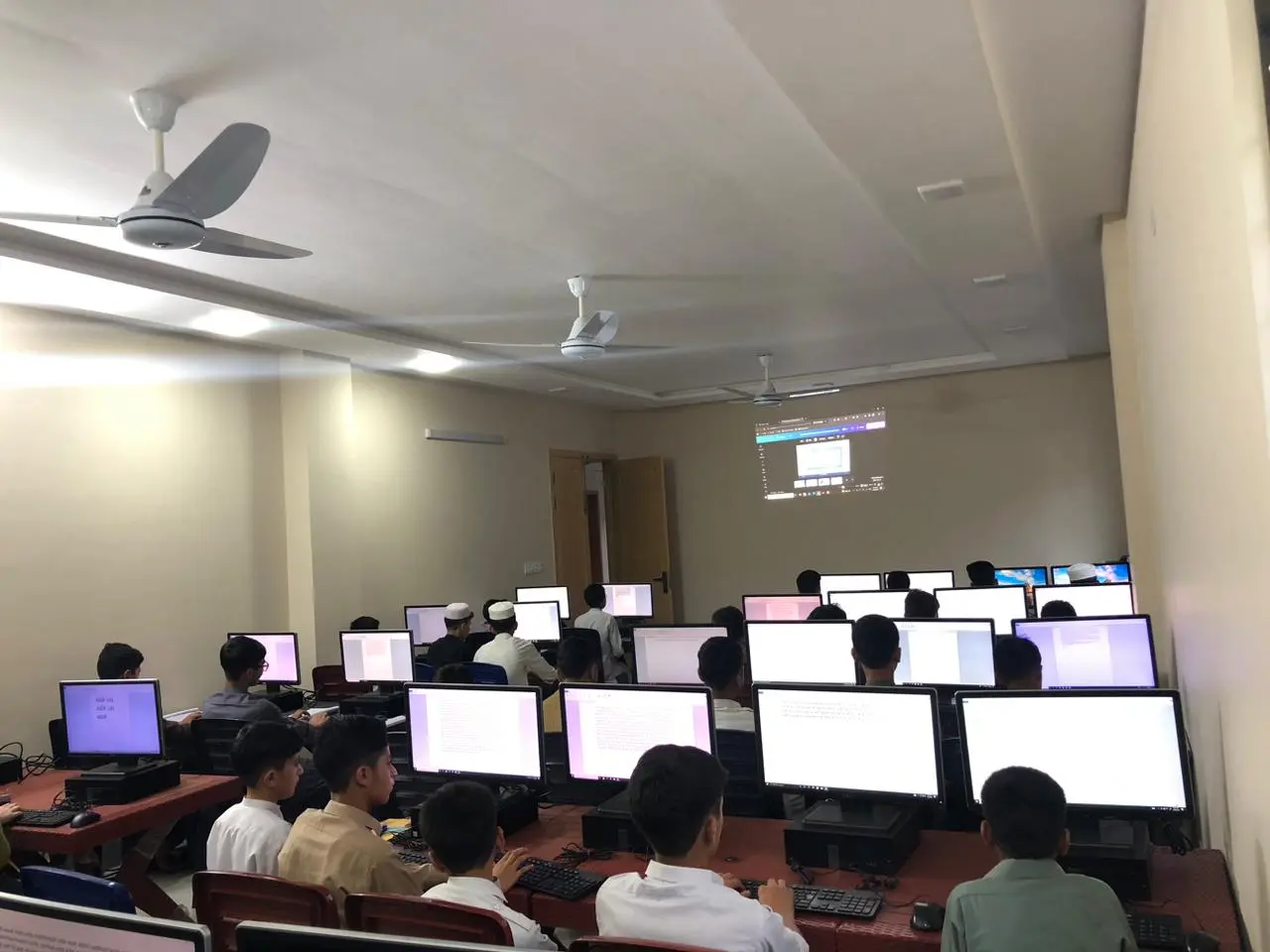 kids using computers in NGO classroom environment